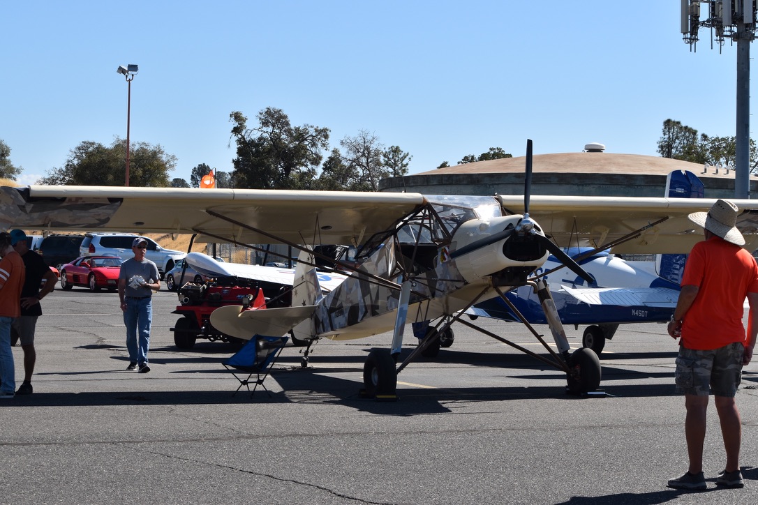 Slepcev Storch in desert camouflage livery at an airshow, front three-quarter view